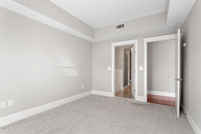 unfurnished bedroom featuring light colored carpet