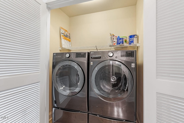 washroom with washer and dryer