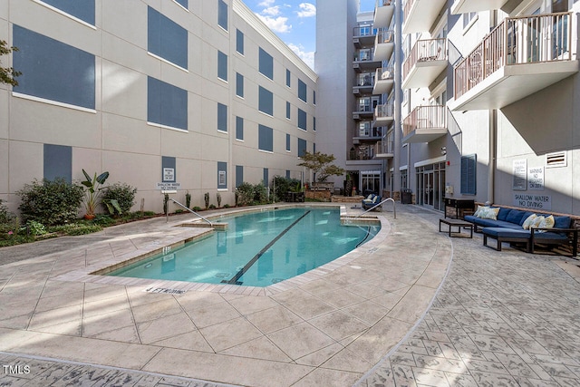 view of swimming pool with a patio area