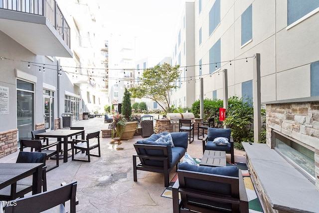 view of patio / terrace featuring an outdoor living space with a fireplace