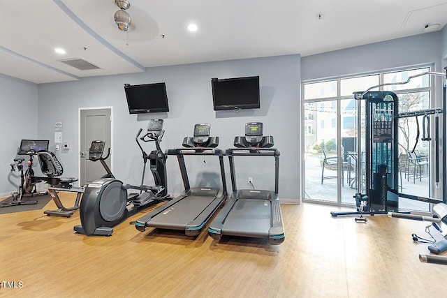 workout area featuring hardwood / wood-style flooring