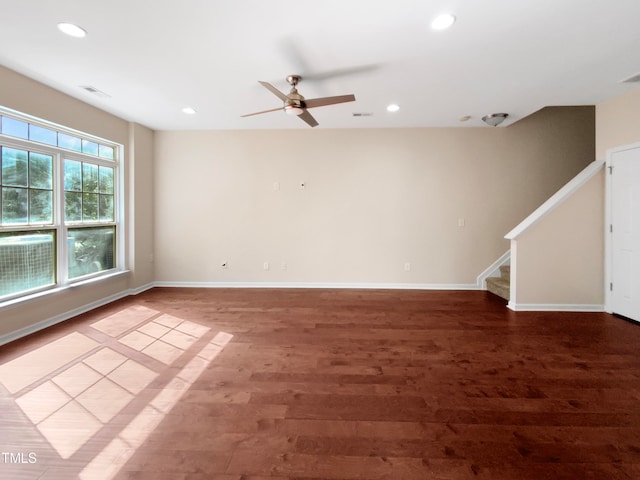 spare room with hardwood / wood-style floors and ceiling fan