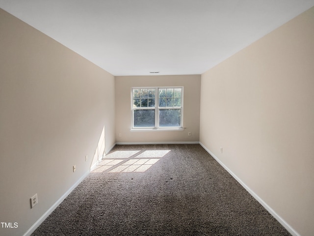 empty room featuring light carpet