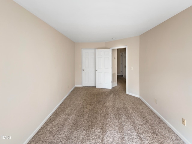 unfurnished bedroom with a closet and carpet