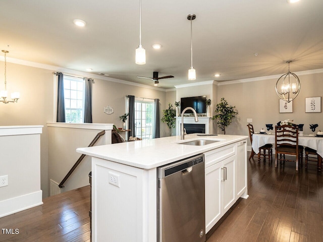 kitchen with decorative light fixtures, a kitchen island with sink, plenty of natural light, and stainless steel dishwasher