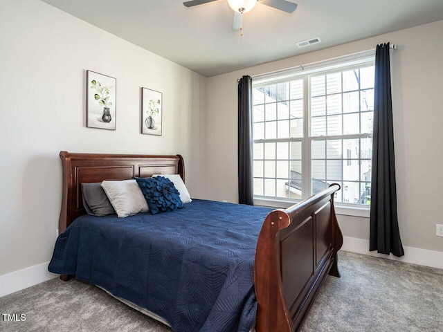 bedroom with light carpet and ceiling fan