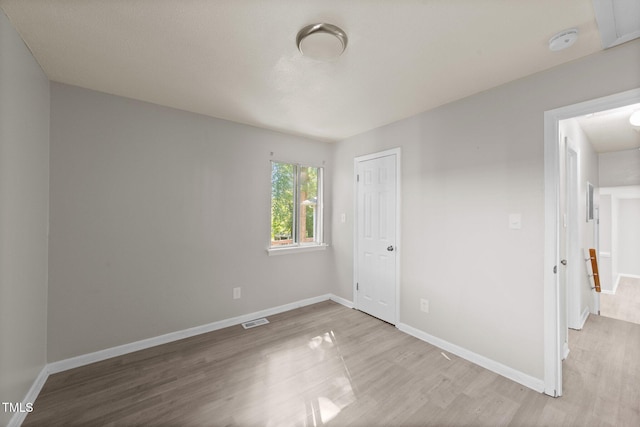 unfurnished room featuring light hardwood / wood-style flooring