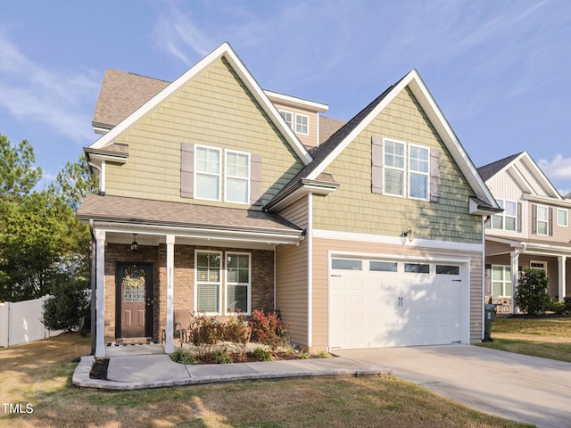 view of front facade featuring a porch and a garage