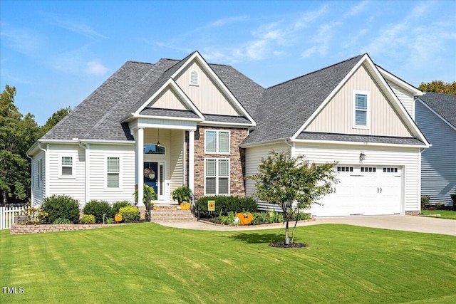 view of front of property with a front lawn and a garage