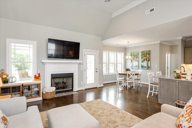 living room featuring plenty of natural light, ornamental molding, high vaulted ceiling, and dark hardwood / wood-style flooring