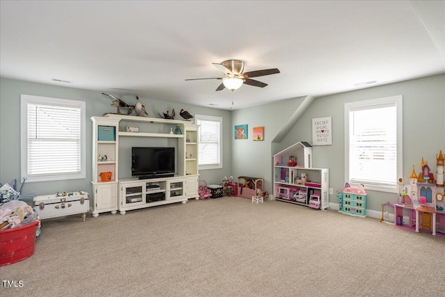 playroom with ceiling fan, plenty of natural light, and carpet