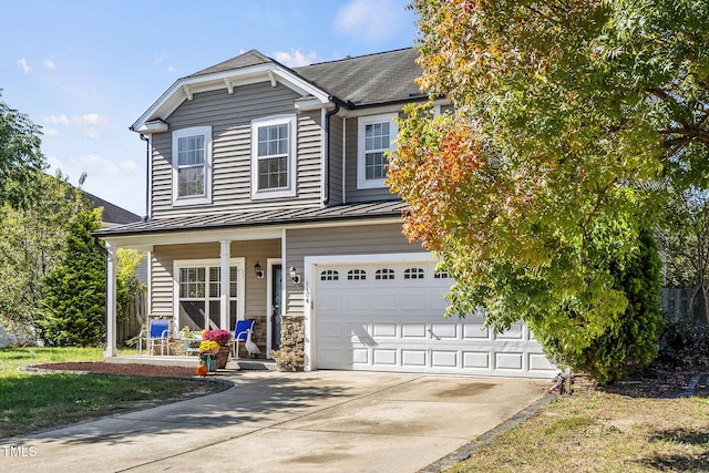 view of front of house with a porch and a garage