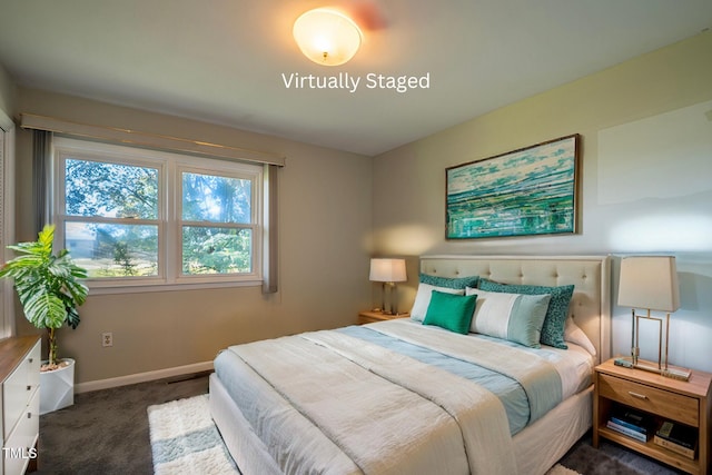 bedroom featuring dark colored carpet