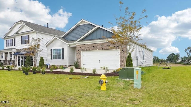 view of front of house featuring a garage and a front lawn