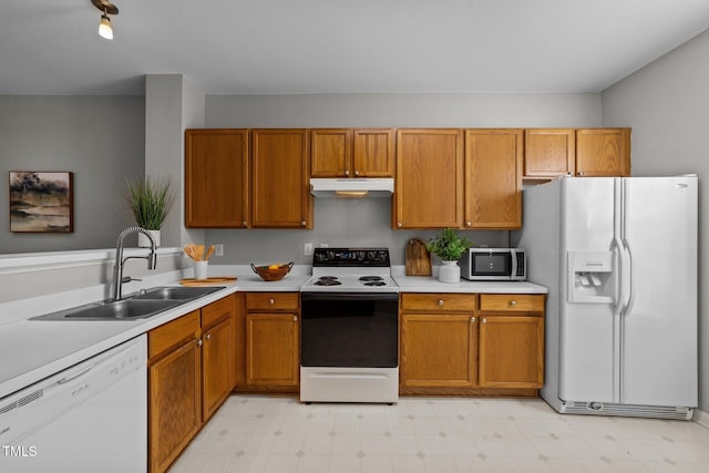 kitchen with white appliances and sink