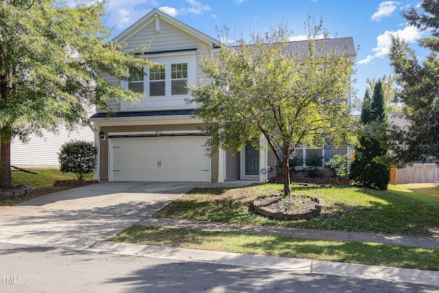 view of front of house featuring a front yard and a garage