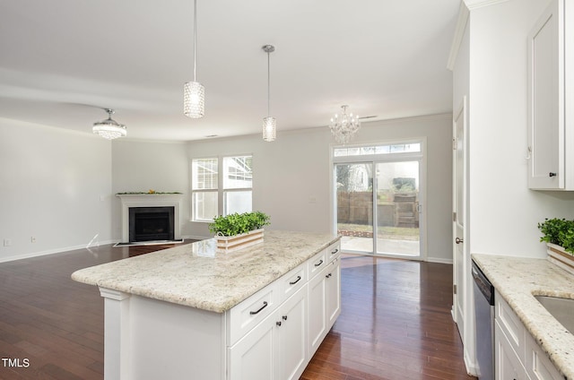 517 Birchrun Dr, Durham, NC 27712 - kitchen with dark wood finished floors, white cabinetry, a kitchen island, crown molding, and pendant lighting