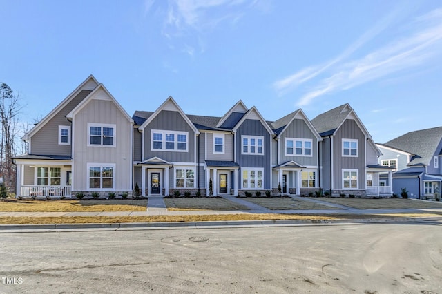 view of property featuring a residential view and board and batten siding