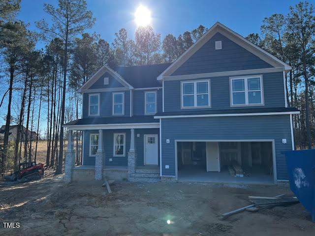 view of front of home with a garage and a porch