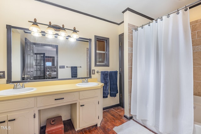 bathroom with vanity, shower with separate bathtub, hardwood / wood-style floors, and crown molding