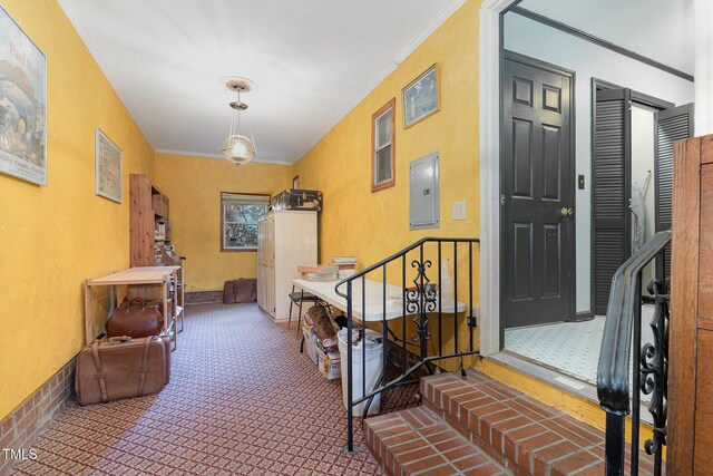 corridor featuring electric panel, crown molding, and carpet flooring