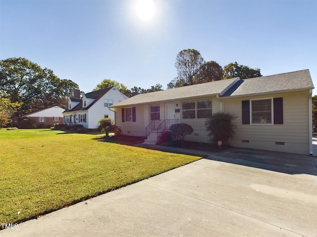 ranch-style home with a front lawn