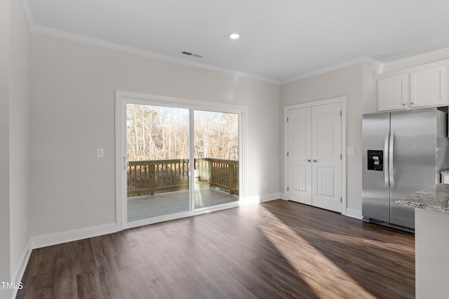 interior space featuring stainless steel refrigerator with ice dispenser, crown molding, dark hardwood / wood-style flooring, light stone counters, and white cabinetry