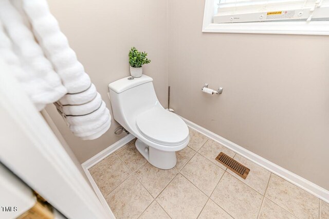 bathroom featuring tile patterned floors and toilet