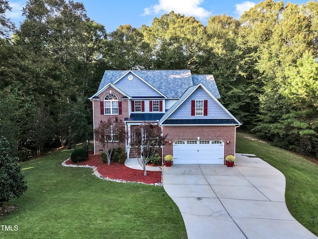 319 River Knoll Dr, Clayton, NC 27527 - view of front of house with a garage, brick siding, driveway, and a front lawn