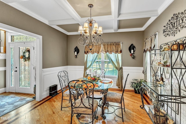 319 River Knoll Dr, Clayton, NC 27527 - dining room featuring a chandelier, light wood-style floors, a wainscoted wall, and coffered ceiling