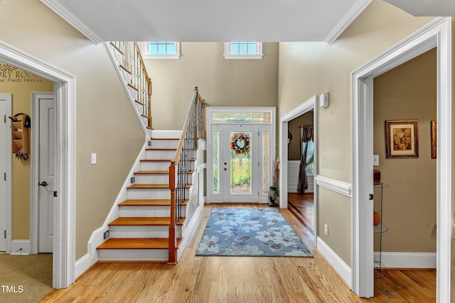 319 River Knoll Dr, Clayton, NC 27527 - foyer entrance featuring stairway, baseboards, ornamental molding, and wood finished floors