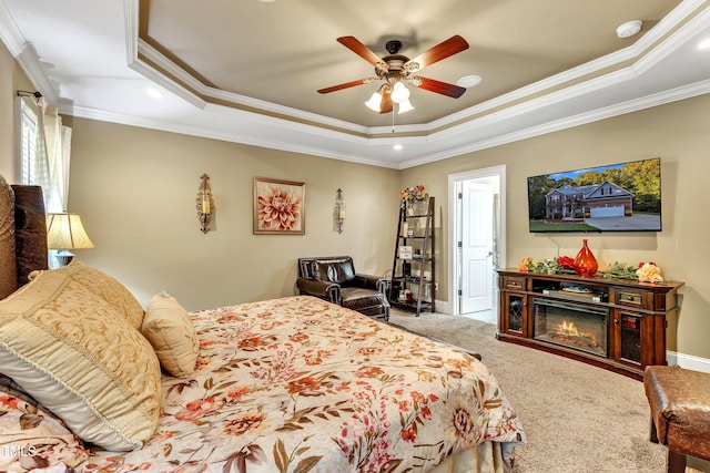 319 River Knoll Dr, Clayton, NC 27527 - bedroom featuring a tray ceiling, ornamental molding, a ceiling fan, and carpet floors