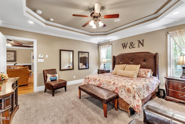 319 River Knoll Dr, Clayton, NC 27527 - bedroom with light carpet, multiple windows, a tray ceiling, and ornamental molding