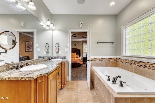 319 River Knoll Dr, Clayton, NC 27527 - ensuite bathroom featuring double vanity, a jetted tub, a sink, and connected bathroom