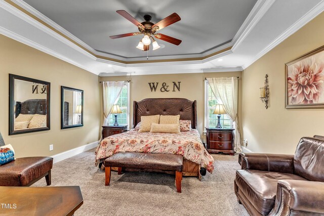 319 River Knoll Dr, Clayton, NC 27527 - carpeted bedroom with crown molding, a tray ceiling, baseboards, and ceiling fan