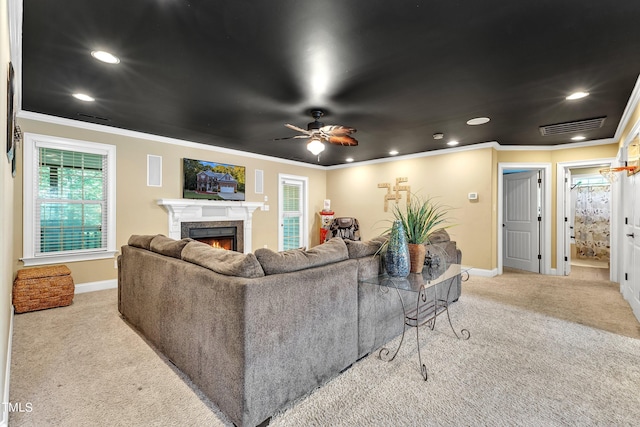 319 River Knoll Dr, Clayton, NC 27527 - carpeted living area with recessed lighting, baseboards, crown molding, and a lit fireplace