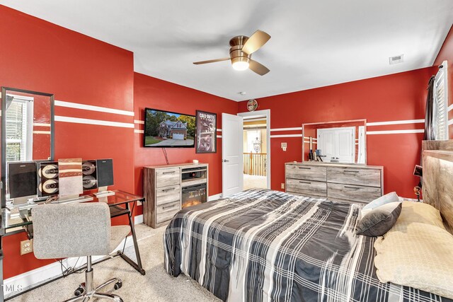 319 River Knoll Dr, Clayton, NC 27527 - bedroom featuring carpet flooring, visible vents, and a ceiling fan