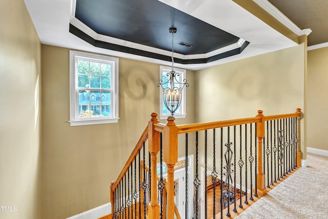 319 River Knoll Dr, Clayton, NC 27527 - hall with baseboards, an upstairs landing, crown molding, visible vents, and a raised ceiling