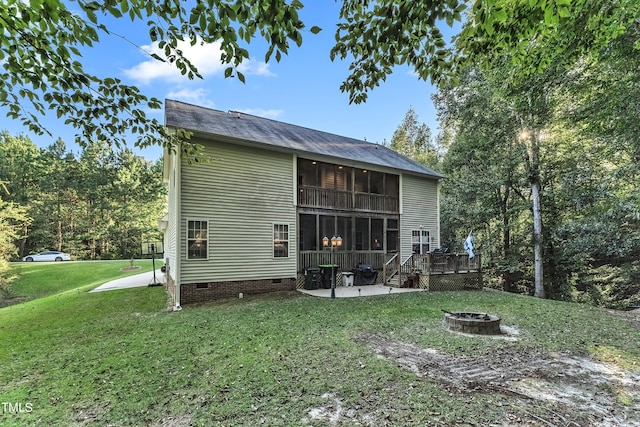 319 River Knoll Dr, Clayton, NC 27527 - back of house featuring a sunroom, an outdoor fire pit, crawl space, a lawn, and a patio