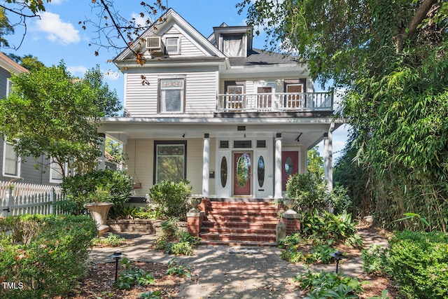 view of front facade with a balcony and a porch