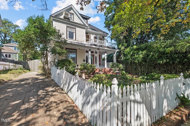 view of front of property with a balcony and a porch