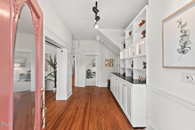 corridor with dark wood-type flooring