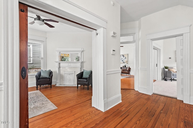 hall with hardwood / wood-style floors