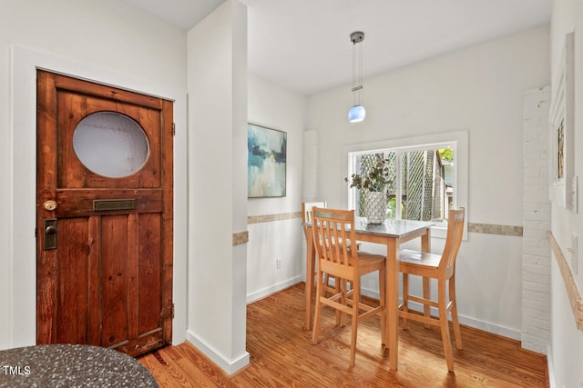 dining area with light hardwood / wood-style floors