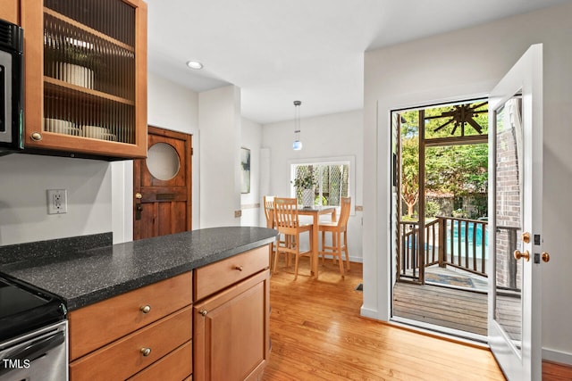 kitchen featuring pendant lighting and light wood-type flooring