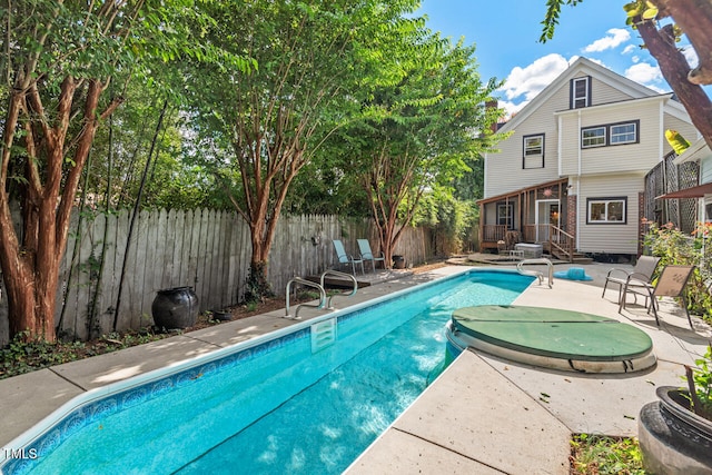 view of pool featuring a patio