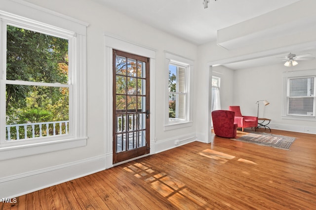 doorway to outside featuring ceiling fan and hardwood / wood-style floors