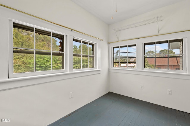 unfurnished sunroom with a wealth of natural light