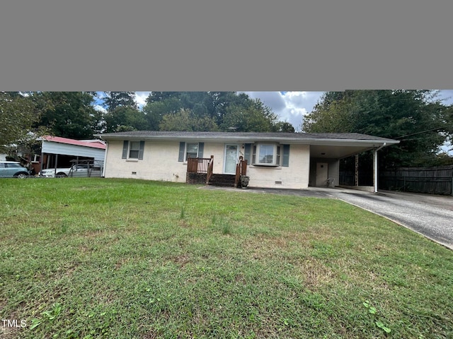 view of front facade with a carport and a front yard