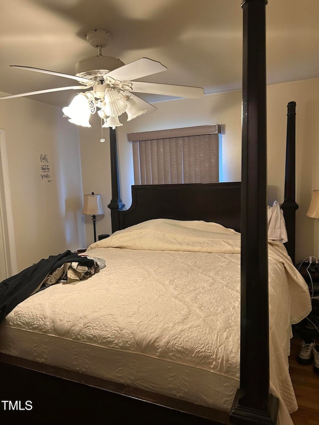 bedroom with ceiling fan and hardwood / wood-style floors